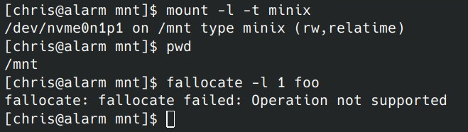 Screenshot of a console session. Commands executed are in order: mount, that shows a minix filesystem mounted under /mnt, pwd that shows the current directory as /mnt and fallocate on a file that results in an Operation not supported error